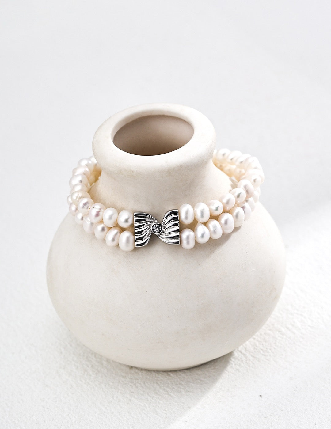 Elegant Double-Strand Pearl Bracelet with Bow Charm – S925 Silver & Zircon