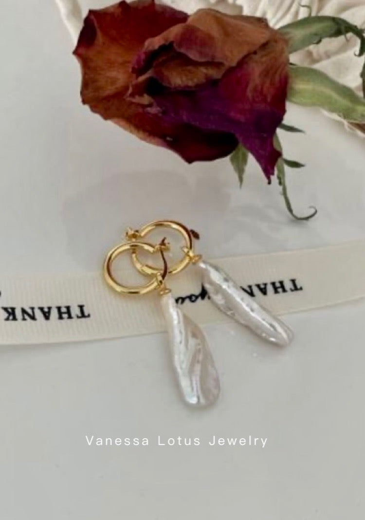 Long baroque pearl earrings
