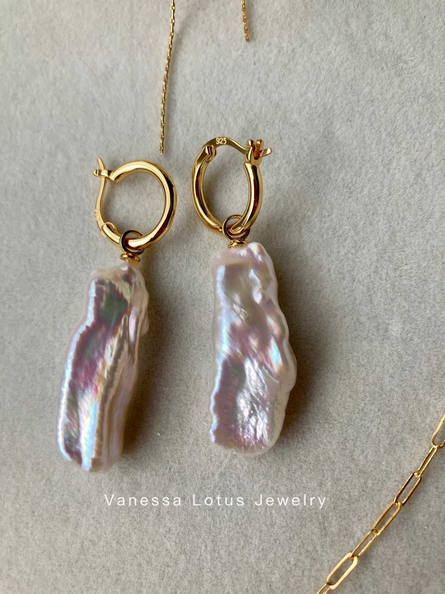 Long baroque pearl earrings