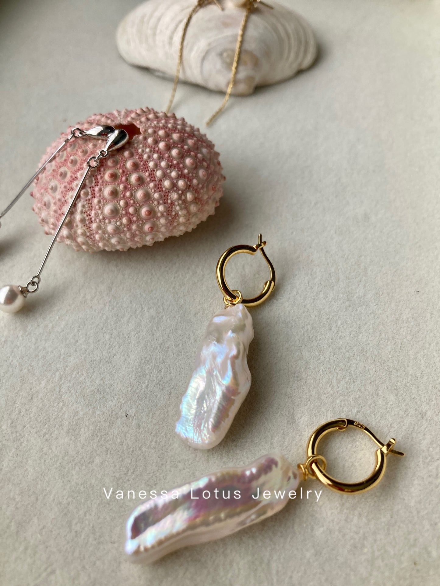 Long baroque pearl earrings