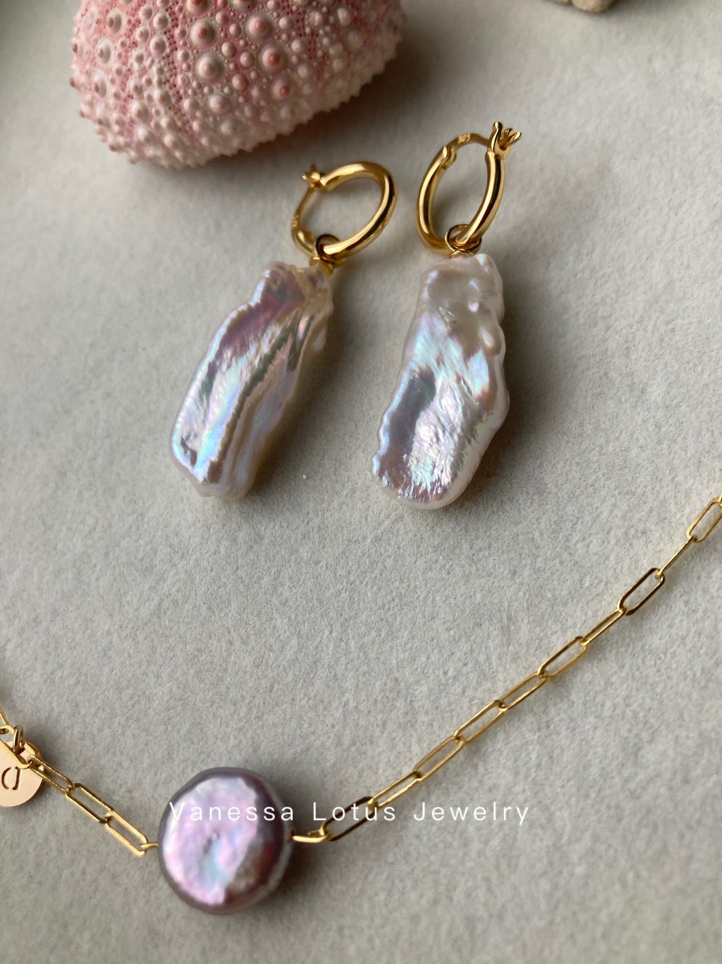 Long baroque pearl earrings