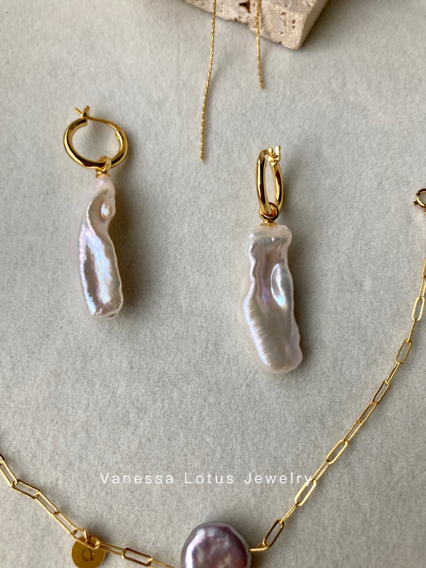 Long baroque pearl earrings
